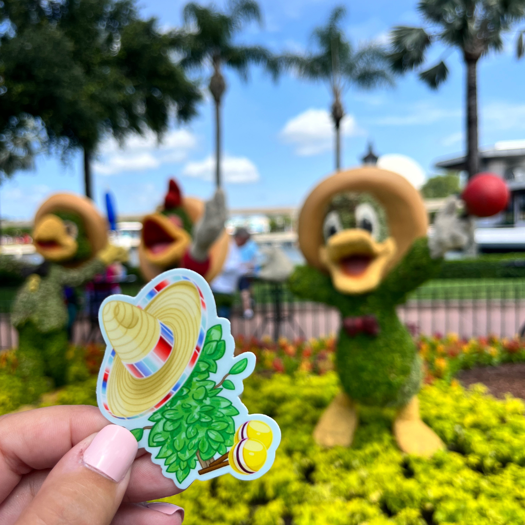 plant Donald sticker in front of Donald topiary 