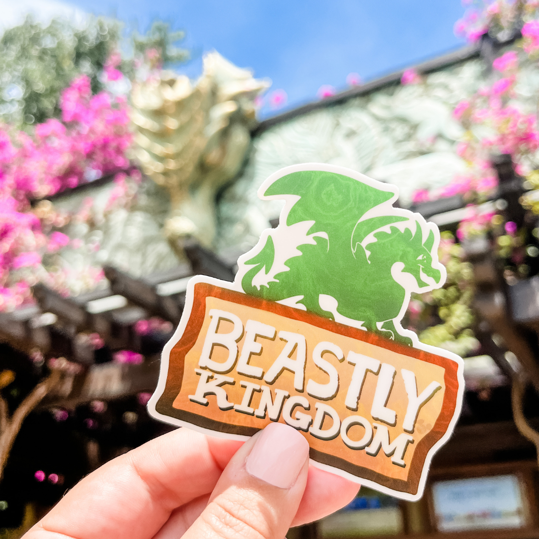 beastly kingdom sticker in front of animal kingdom gate with dragon