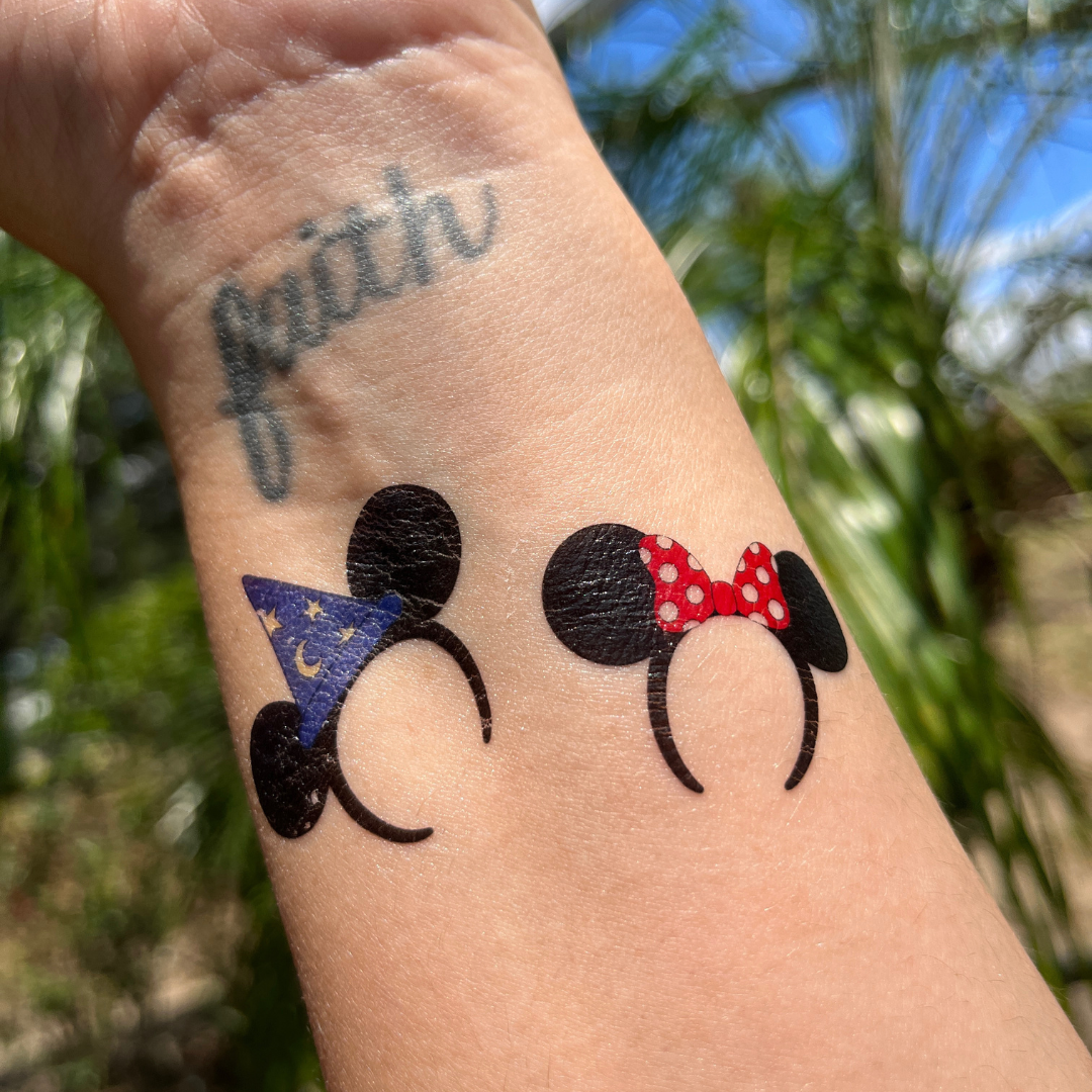 Minnie Mouse tattoo on the inner forearm.