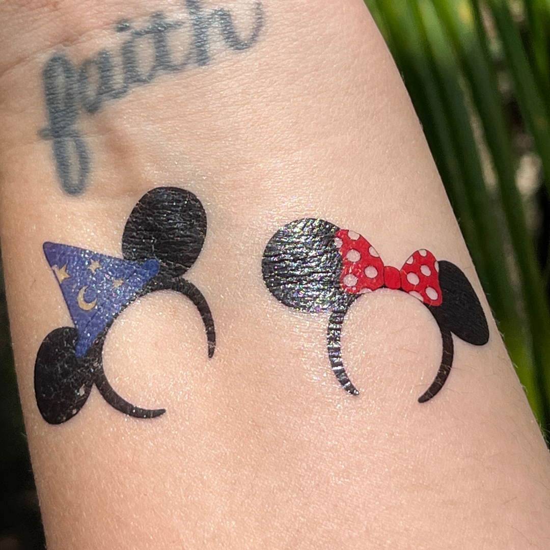 minnie mouse bow tattoo behind ear